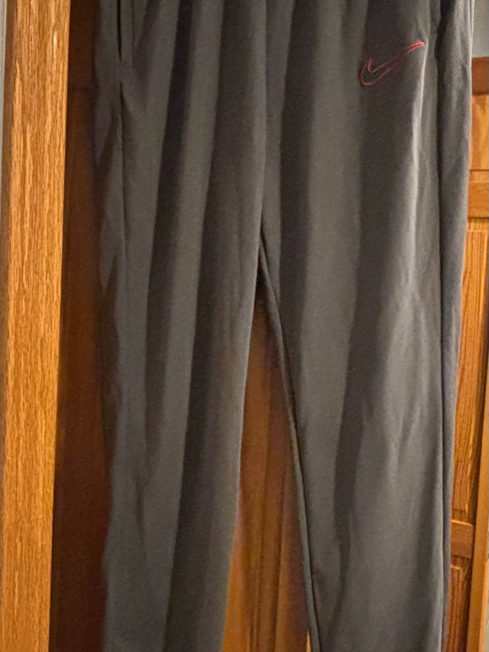 Nike Black Joggers with Red Swoosh Accent